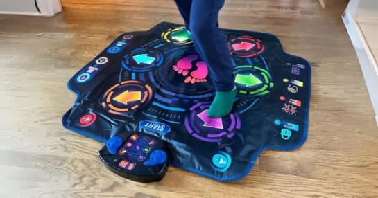 kid dancing on a small Electronic Dance Mat