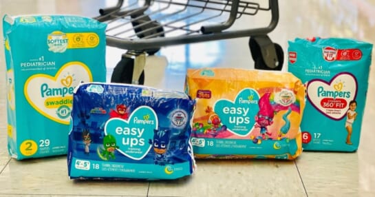 packages of pampers easy ups and diapers in store