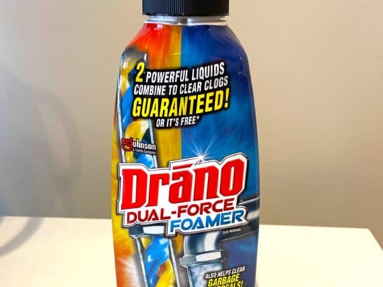 Drano dual foam bottle displayed on top of the toilet seat